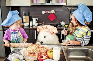 A dog baking with their family